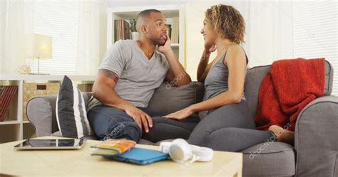 African American Couple Talking Together On Couch — Stock