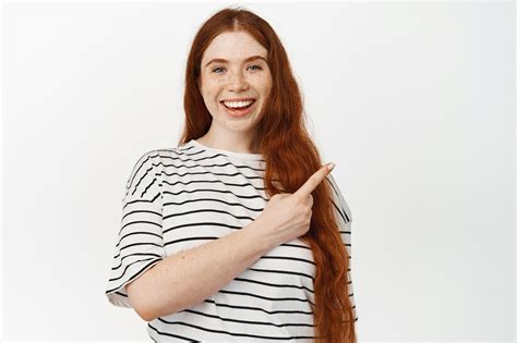 Free Photo Portrait Of Beautiful Natural Redhead Girl Pointing At