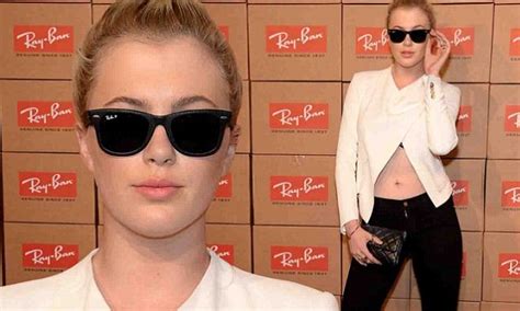 ireland baldwin plays coy while displaying her taut tummy