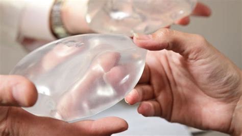 woman s breast implant falls out of chest fox news