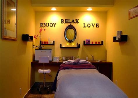 i love the idea of this wall with the shelves with the words about them massage room decor