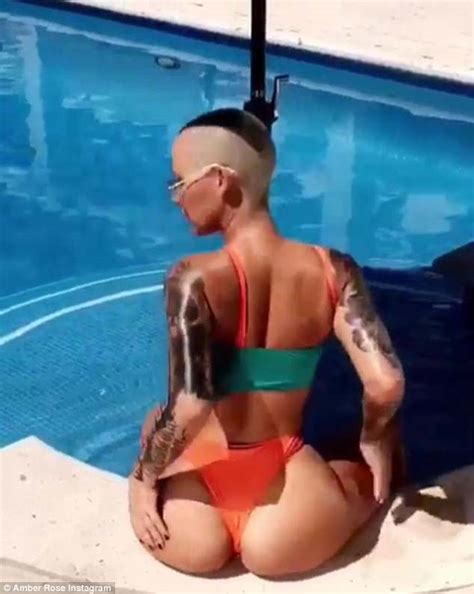 amber rose looks booty ful in orange swimsuit after