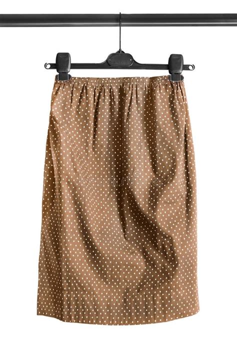 skirt  clothes rack stock photo image  studio brown