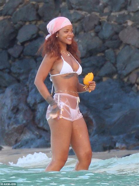 rihanna displays her toned beach body in a string bikini in hawaii