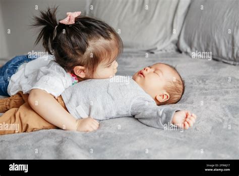 siblings hug asian  res stock photography  images alamy