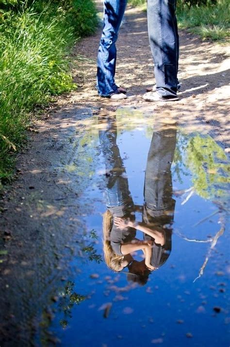 reflection of a kiss love cute couples kiss water outdoors country reflection teens mud