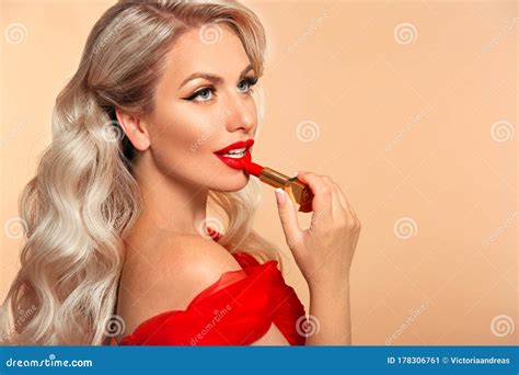 Blonde Applying Red Lipstick On Lips Beauty Woman Makeup Stock Image