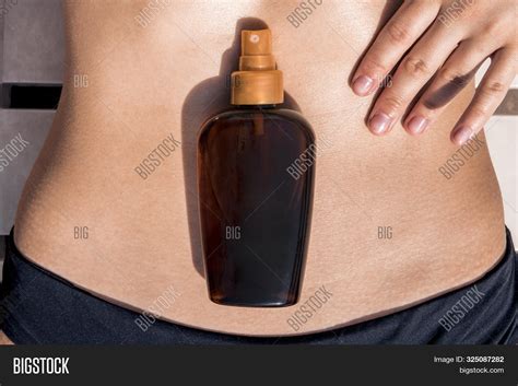 Girl Oil Spray Tanning Image And Photo Free Trial Bigstock