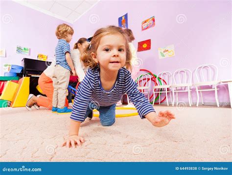 girl crawl  active class lesson  kindergarten stock photo image