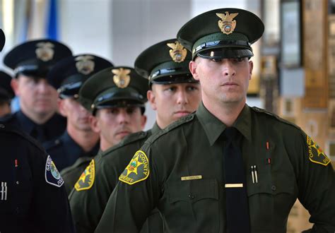 dozens   officers join orange countys ranks   badge