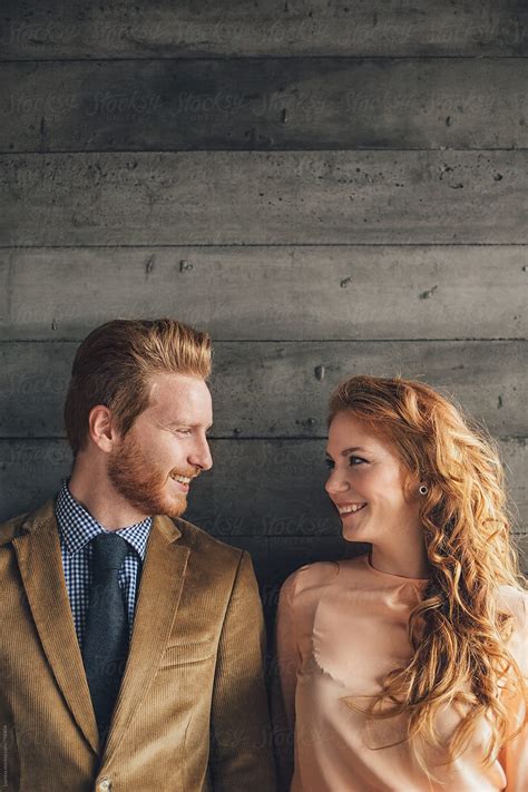 Ginger Couple Looking At Each Other By Stocksy Contributor Lumina