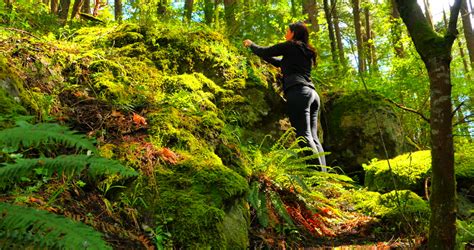 sexy girl leaning huge tree in rainforest background waterfall stock footage video 3045112