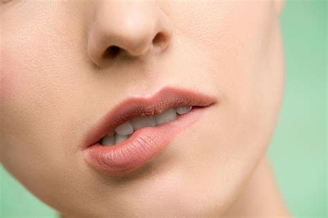 woman biting  lips  stock photo