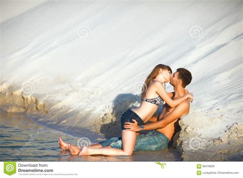 Lovers Kissing On The Beach In Water Stock Image Image