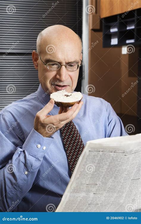 businessman eating bagel stock photo image  paper bagel