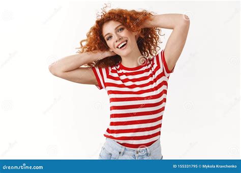 lively happy joyful redhead silly feminine curly haired girl playing