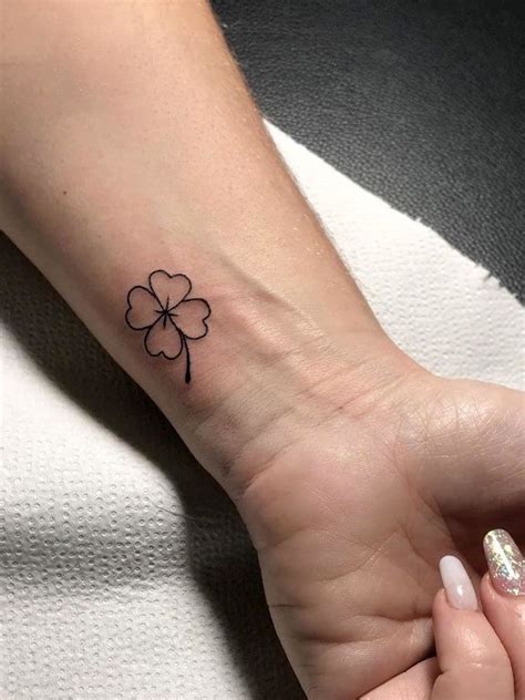 small  leaf clover tattoo   wrist