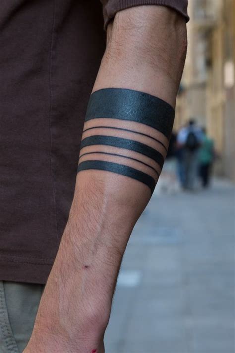 Cool Different Line Black Ink Tribal Band Tattoo On Forearm