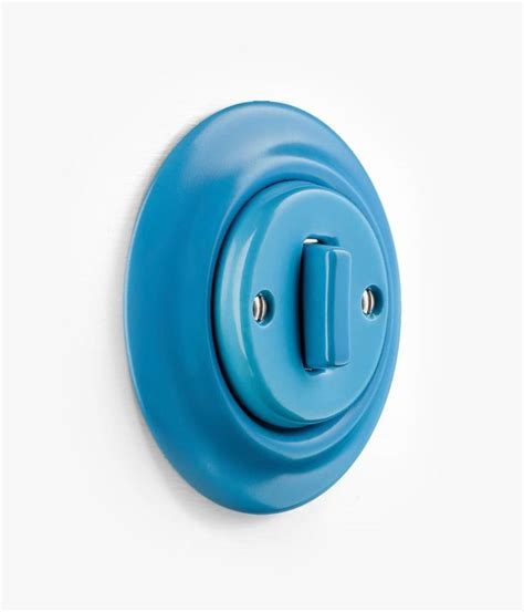 blue button   white wall