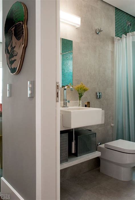A Bathroom With A Toilet Sink And Shower Curtain In The Doorway