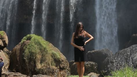 beautiful woman  waterfall   tropics stock footage video