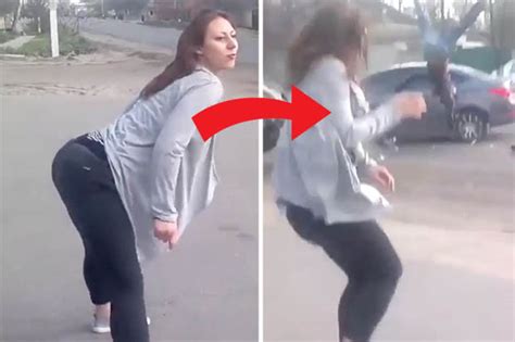 twerking babe beside road causes biker to smash into car