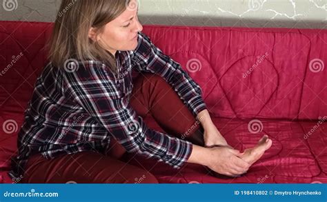 Woman Massages Her Foot With Negative Emotions Middle Aged Or Elder