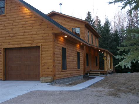 renovating  detached garage  log cabin wood siding