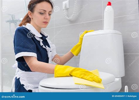 Housekeeper Or Maid Cleaning A White Bathroom Stock Image Image Of