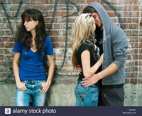 download this stock image teenagers kissing near teenage