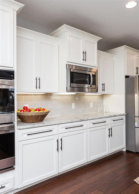 sophisticated classic  white kitchen features belleair maple