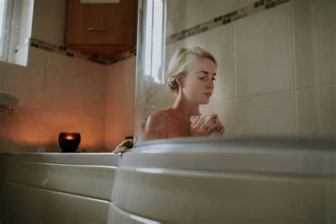 naked woman sitting inside bath tub photo free uncomfortable image on
