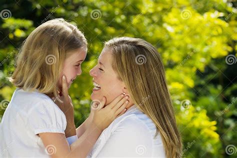 Mother And Daughter Sharing A Moment Together Outdoors Stock Image
