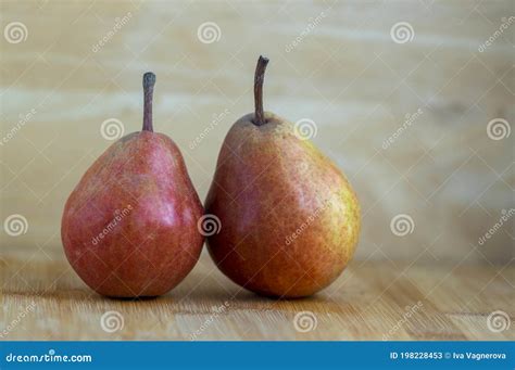 Two Pears Edible Fruits Tasty Ripened Red Yellow Fruit On Wooden