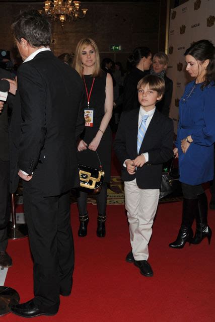 Hugh Grant Takes Liz Hurley S Son As His Plus One To The Pirates Premiere