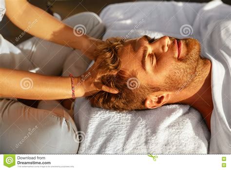 spa massage man enjoying relaxing head massage outdoors beauty stock