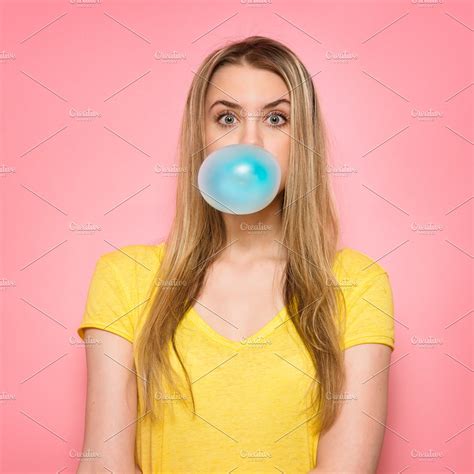 Cute Girl Blowing Blue Bubble Gum High Quality People Images