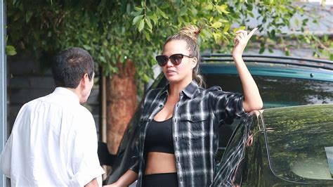 Chrissy Teigen Is All About The Maternity Crop Top Glamour