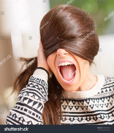 angry young woman hiding face  hair indoors stock photo  shutterstock