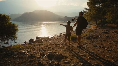 father  son walk   coast holding hands stock video footage
