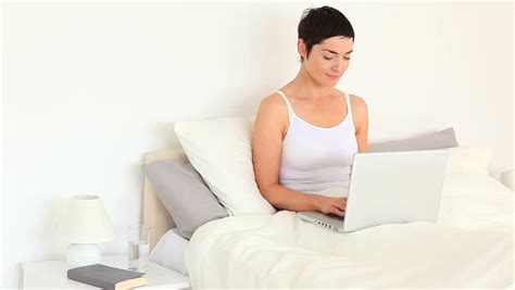 nude woman hugging pillow on bed stock footage video