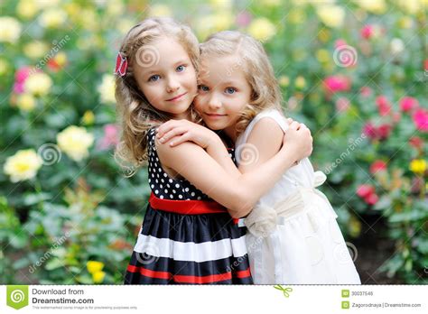 Portrait Of Two Sisters Twins Royalty Free Stock Image