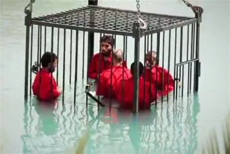 new footage shows isis drown prisoners in a cage daily star