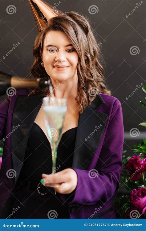 A Brunette Woman With A Glass And A Bottle Of Champagne Stock Image