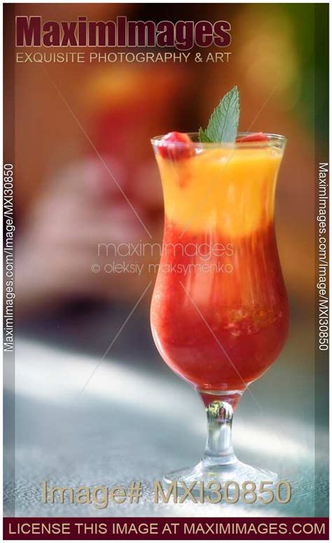 photo of glass of strawberry mango margarita mocktail fruit drink