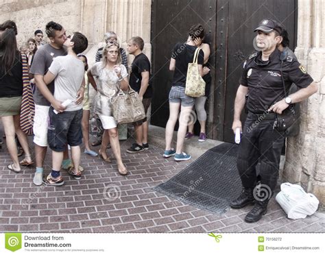 Police Officer Standing Next To A Street Gay Parade