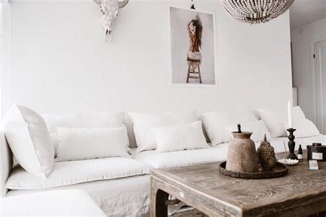 boho chic living room white linen sofa touches of wood