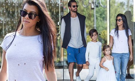 Kourtney Kardashian Goes For A Classic Look In Distressed Jeans And