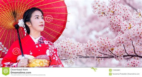 asian woman wearing japanese traditional kimono and cherry