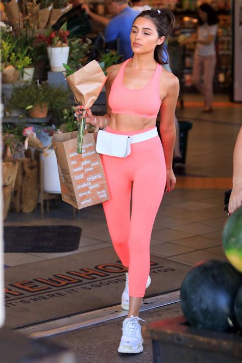 olivia culpo shows off her toned abs in her pink workout gear while
